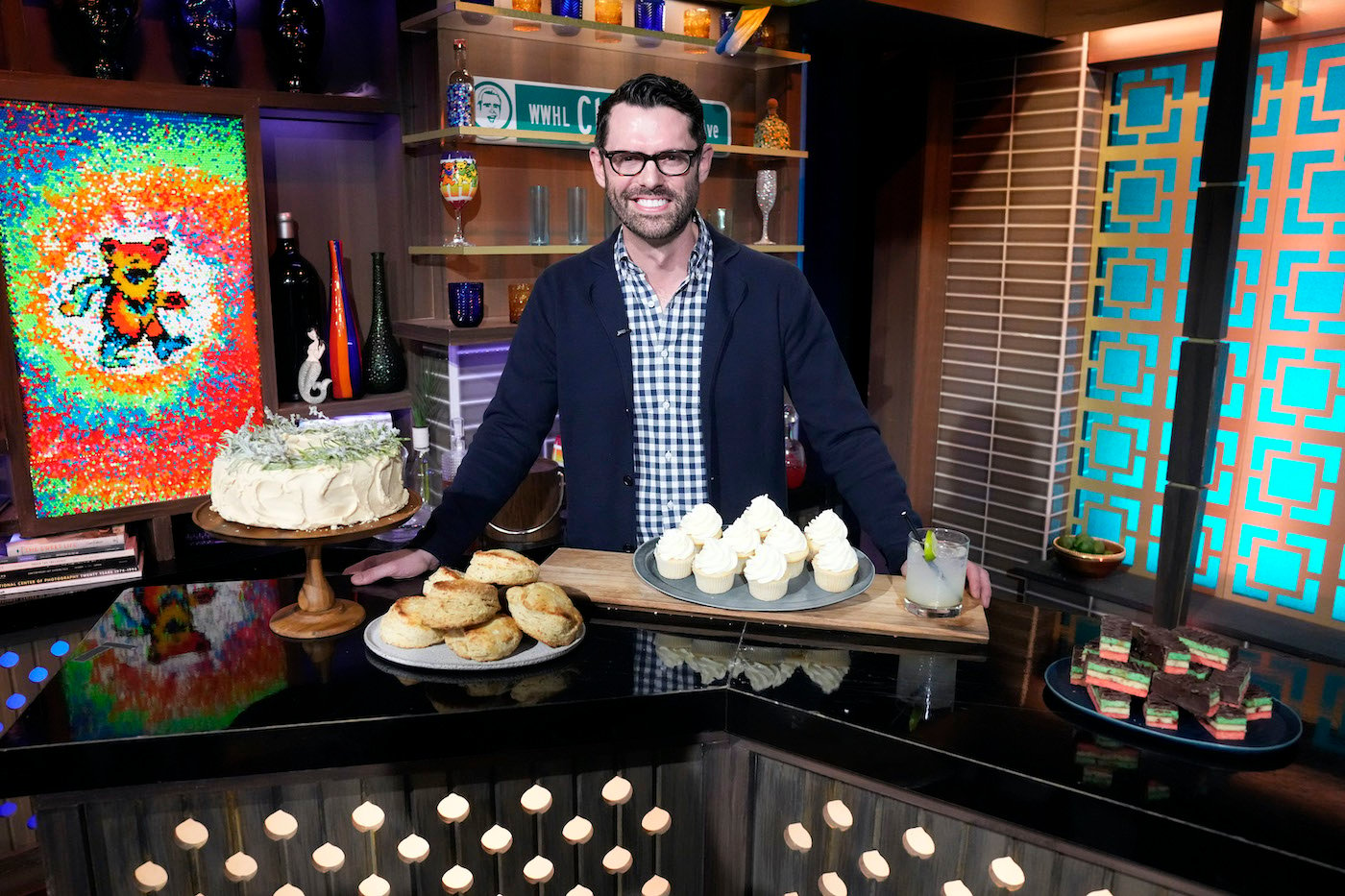 John Kanell from the 'Preppy Kitchen' stands behind the bar at 'WWHL'
