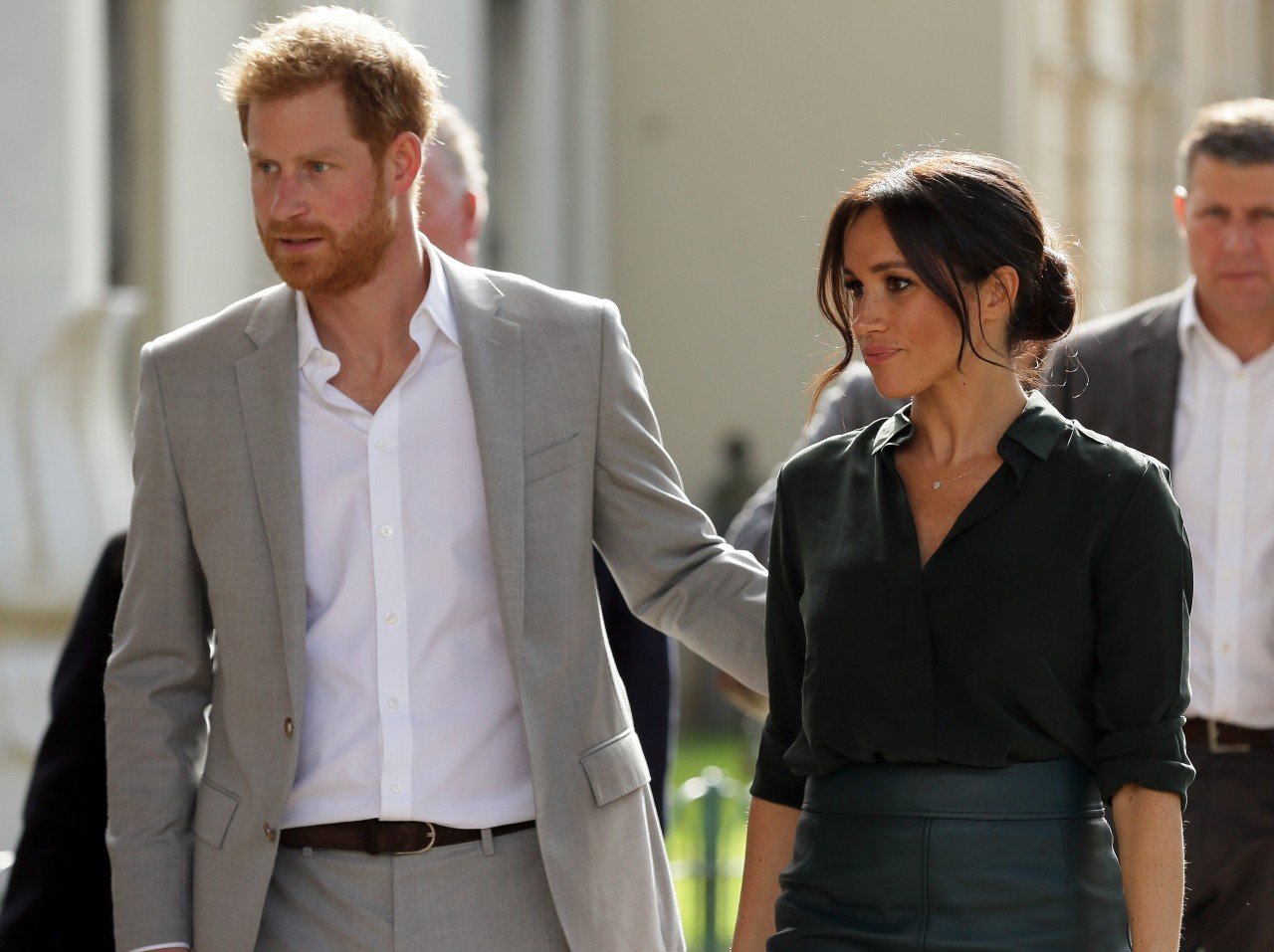 Prince Harry and Meghan Markle walk together.