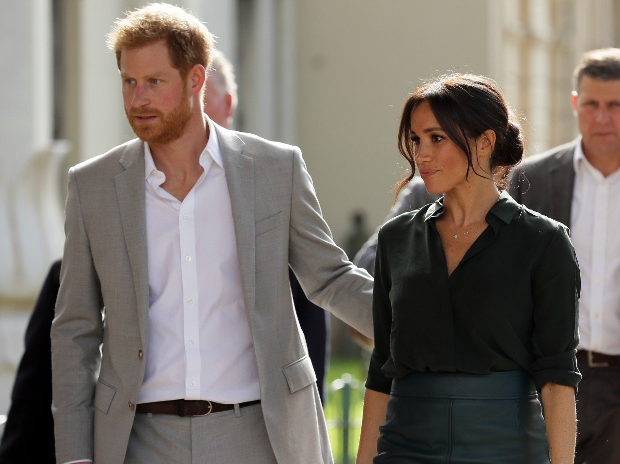 Prince Harry and Meghan Markle walk together. 
