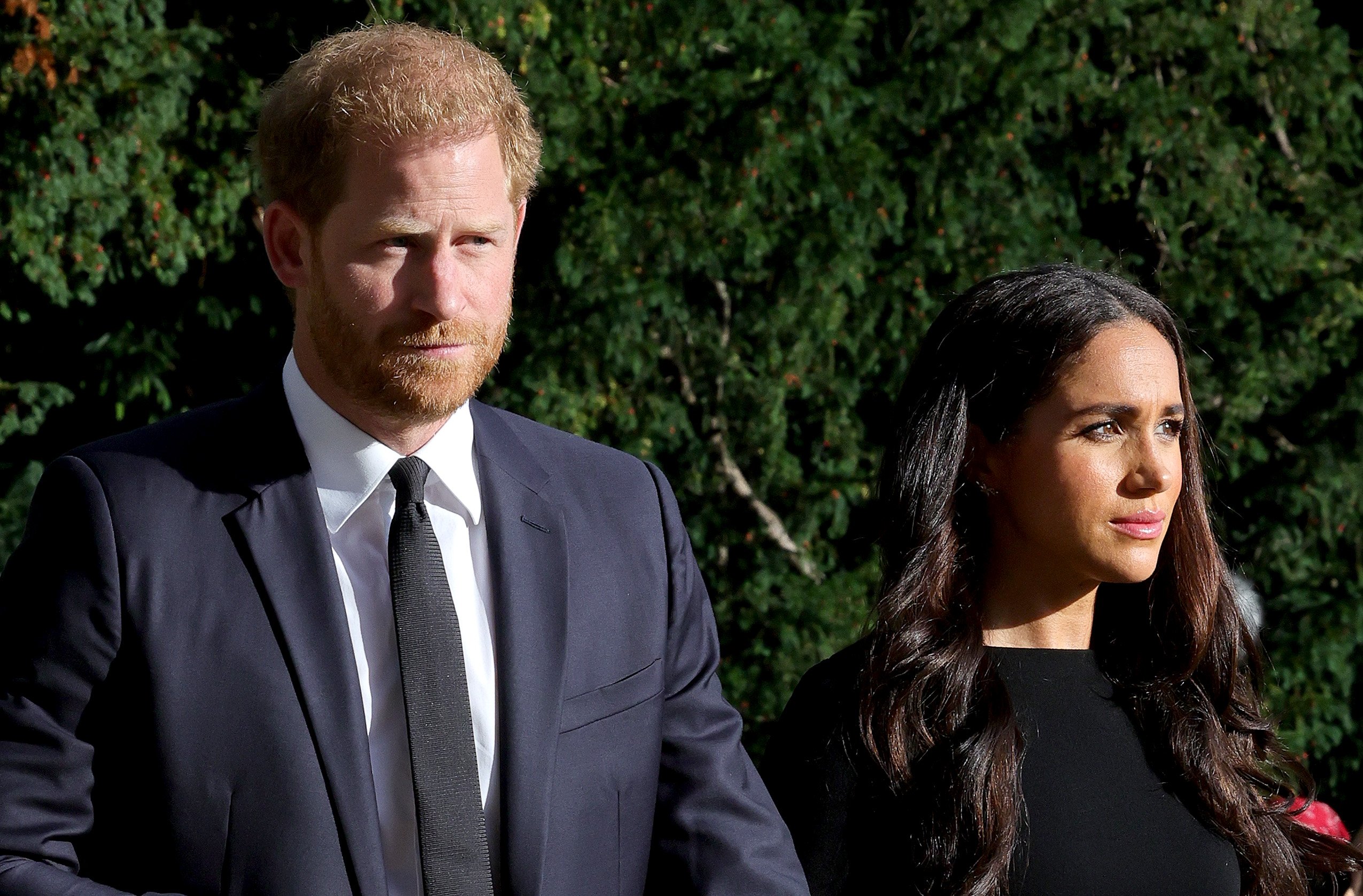 Prince Harry and Meghan Markle stand side-by-side during the walkabout after the death of Queen Elizabeth II.