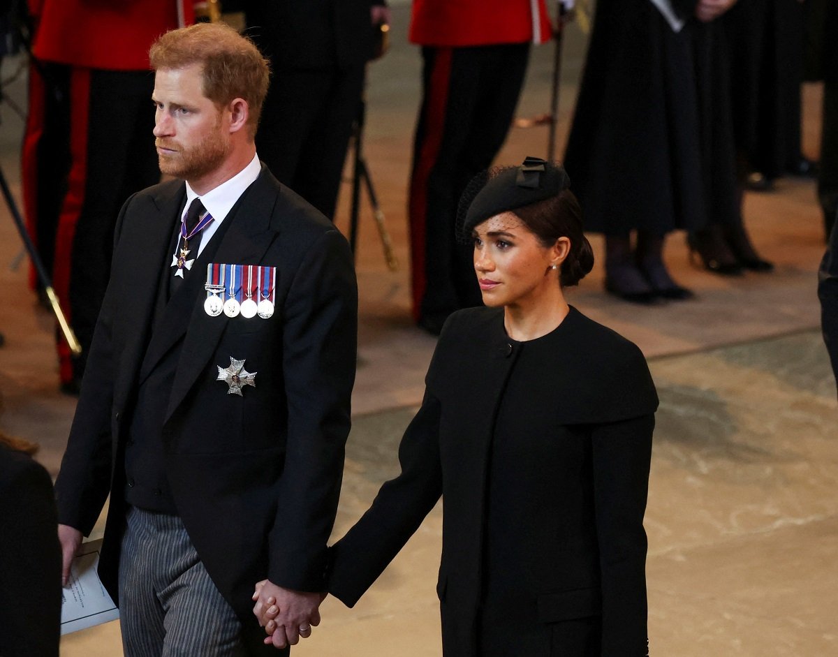 Prince Harry and Meghan Markle arrive in the Palace of Westminster after the procession for the lying-in state of Queen Elizabeth II