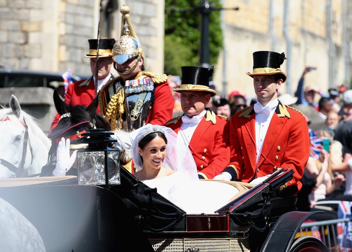 Prince Harry and Meghan Markle, who King Charles' friend Lady Anne Glenconner commented on, leave Windsor Castle in the Ascot Landau carriage during a procession after getting married