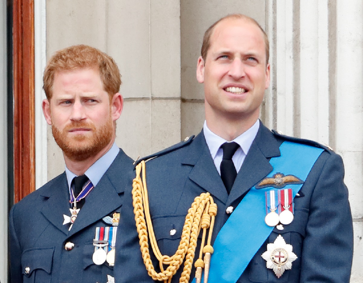 Prince Harry and Prince William watch a flypast to mark the centenary of the Royal Air Force from the balcony of Buckingham Palace