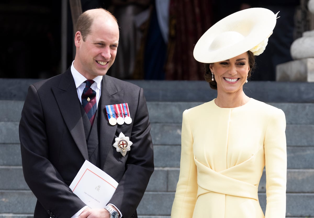 Prince William and Kate Middleton, who a body language expert doesn't believe said, 'wow,' when Prince Harry and Meghan Markle entered the Platinum Jubilee service of Thanksgiving for Queen Elizabeth II in 2022, stand outside St. Paul's Cathedral