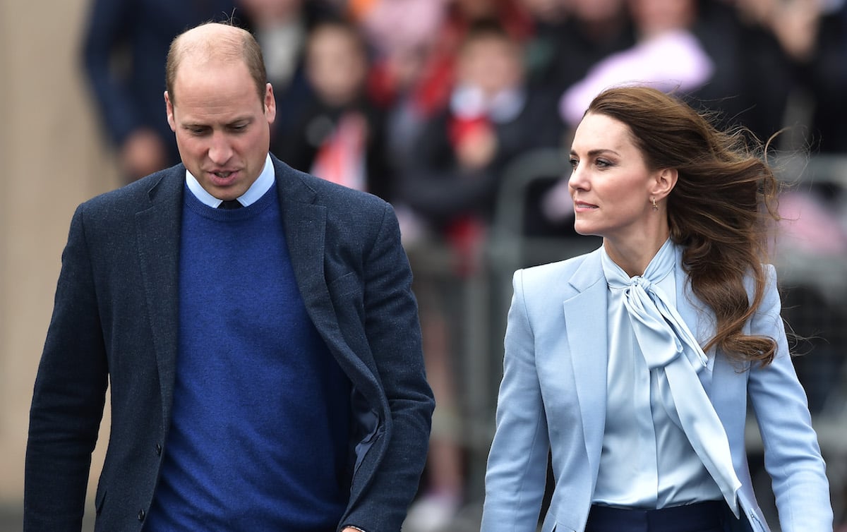 Prince William and Kate Middleton, whose move to Adelaide Cottage has resulted in stress for the family, according to a royal expert, look on during a visit to Northern Ireland
