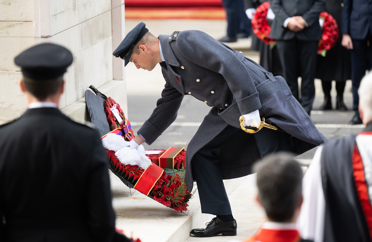 Prince William lays a wreath on behalf of himself and Kate Middleton, which has a simple message, on the Cenotaph during the National Service of Remembrance