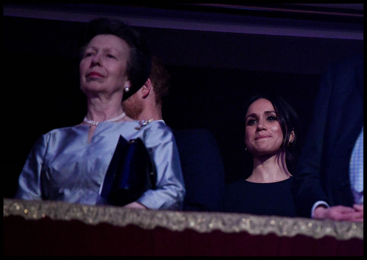 Princess Anne and Meghan Markle, who a body language expert says tried to build a friendship with the Princess Royal, attend a concert to celebrate Queen Elizabeth II's 92nd birthday