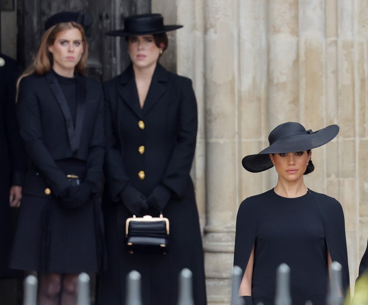 Princess Beatrice and Princess Eugenie, who Meghan Markle reportedly soke to and is now "desperate" to keep her duchess title, all photographed together at Queen Elizabeth II's funeral