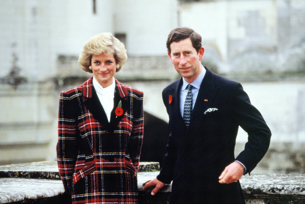 Princess Diana and King Charles III, who Jonathan Dimbleby released a biography, 'The Prince of Wales: A Biography' in 1994 which, according to Kitty Kelley painted Princess Diana as a 'hired womb' stand next to each other in 1988