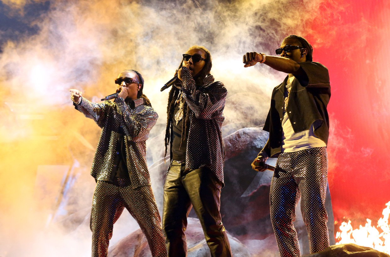Quavo, Takeoff, and Offset of Migos performing on stage