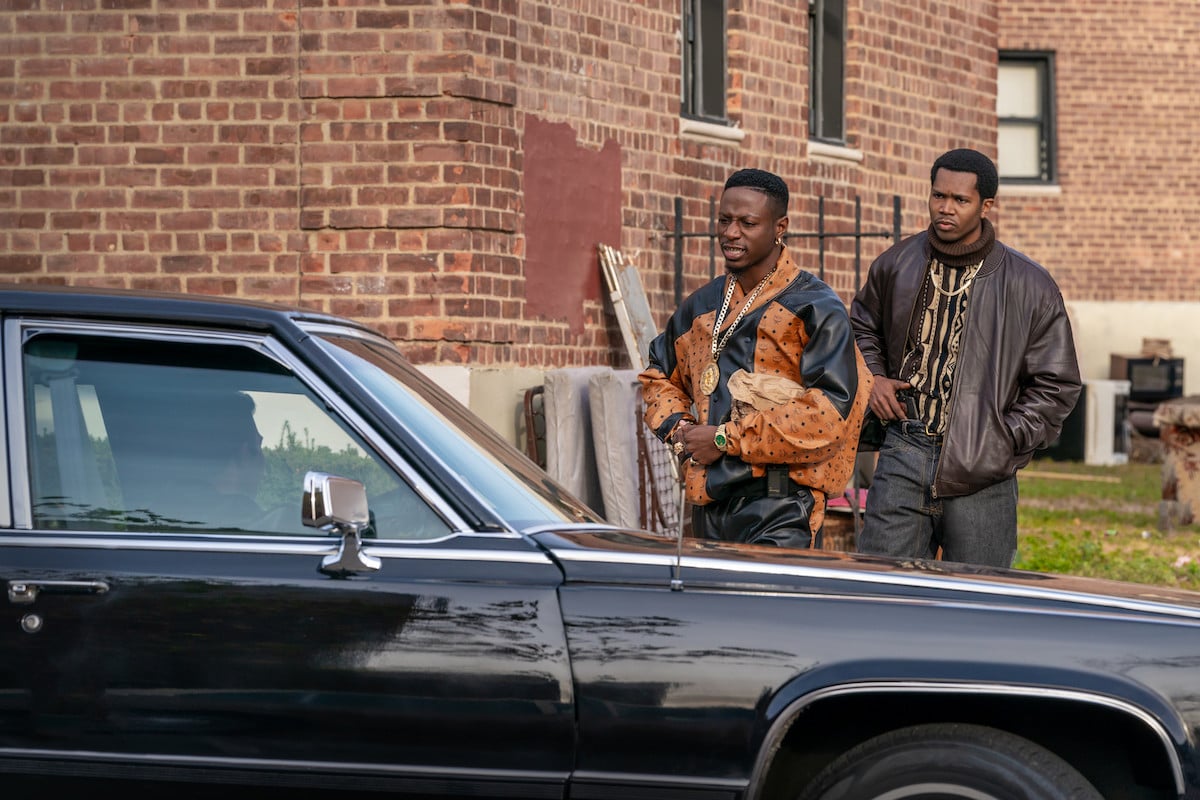 Joey Bada$$ as Unique and John Clay III as Worrell walking up to a car in 'Power Book III: Raising Kanan'