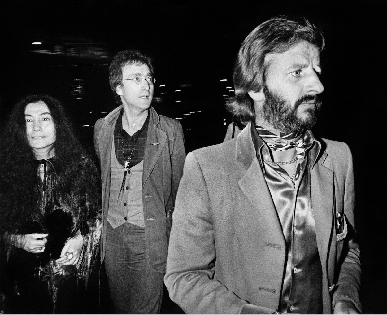 Yoko Ono (from left), John Lennon, and Ringo Starr, their answer to Yoko Ono around The Beatles is the real Ringo, arrive at a Los Angeles club in 1975.