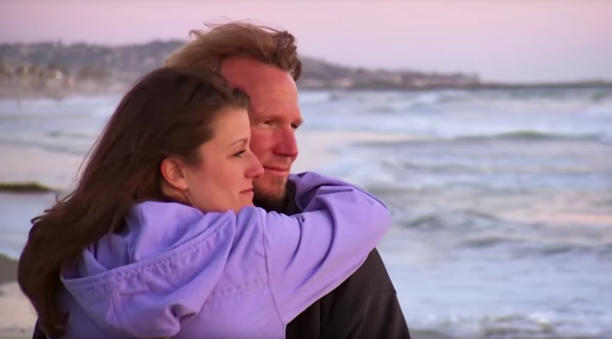 Robyn Brown and Kody Brown embrace at the beach on their honeymoon in 'Sister Wives' Season 1 in San Diego, California.