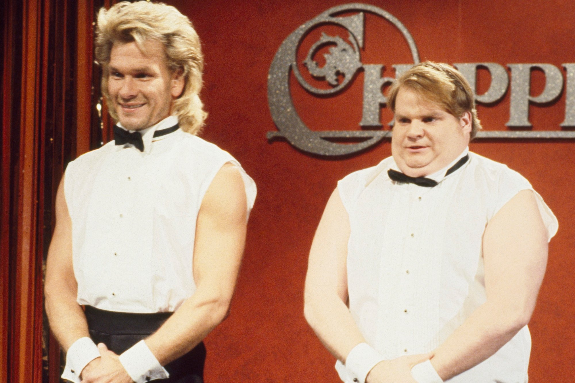 'Saturday Night Live' Patrick Swayze as Adrian, Chris Farley as Barney in 'Chippendales' sketch, wearing white shirts with a black bow tie and black pants.