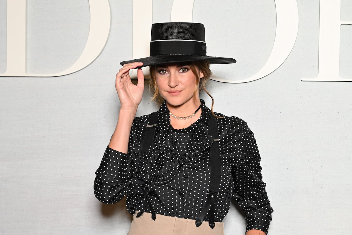 Shailene Woodley in a black top hat and suspenders