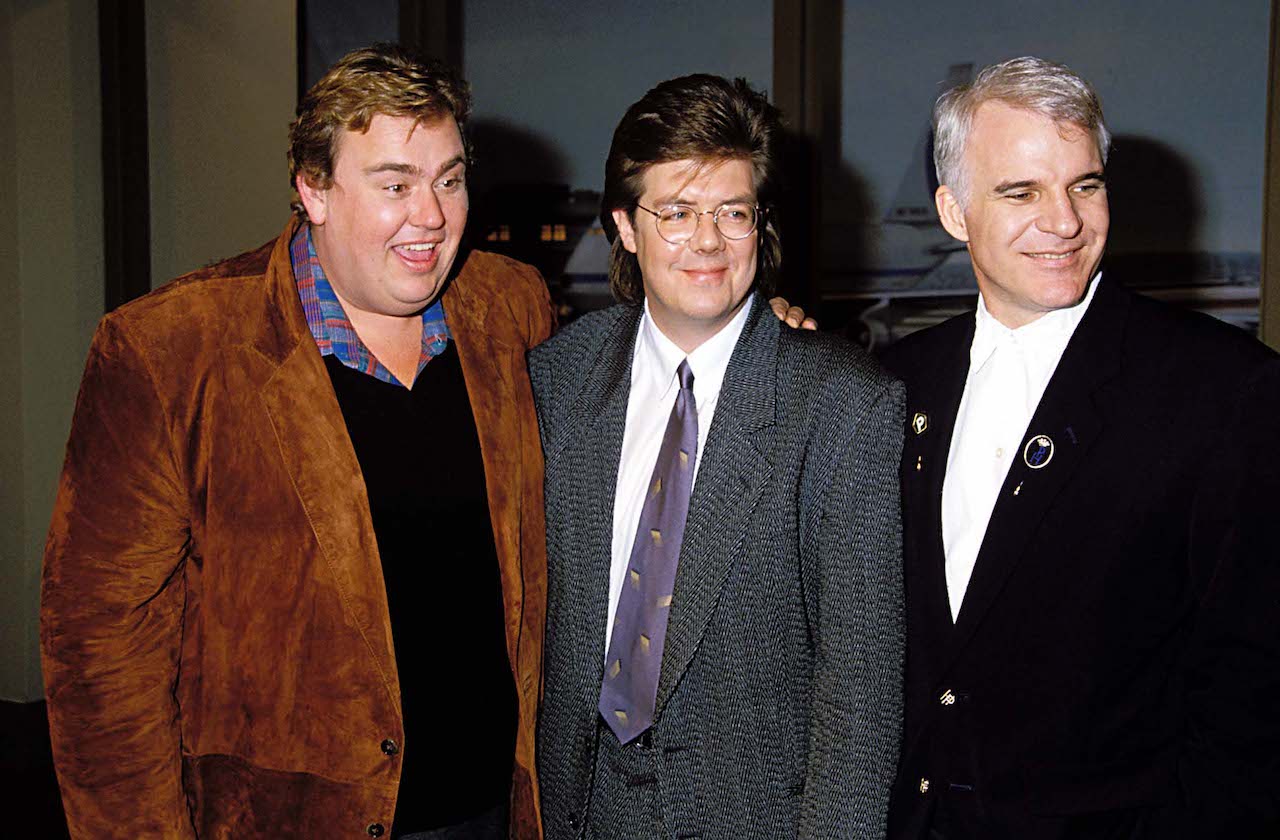 John Candy, 'Planes, Trains, and Automobiles' writer-director John Hughes, and Steve Martin in 1988.