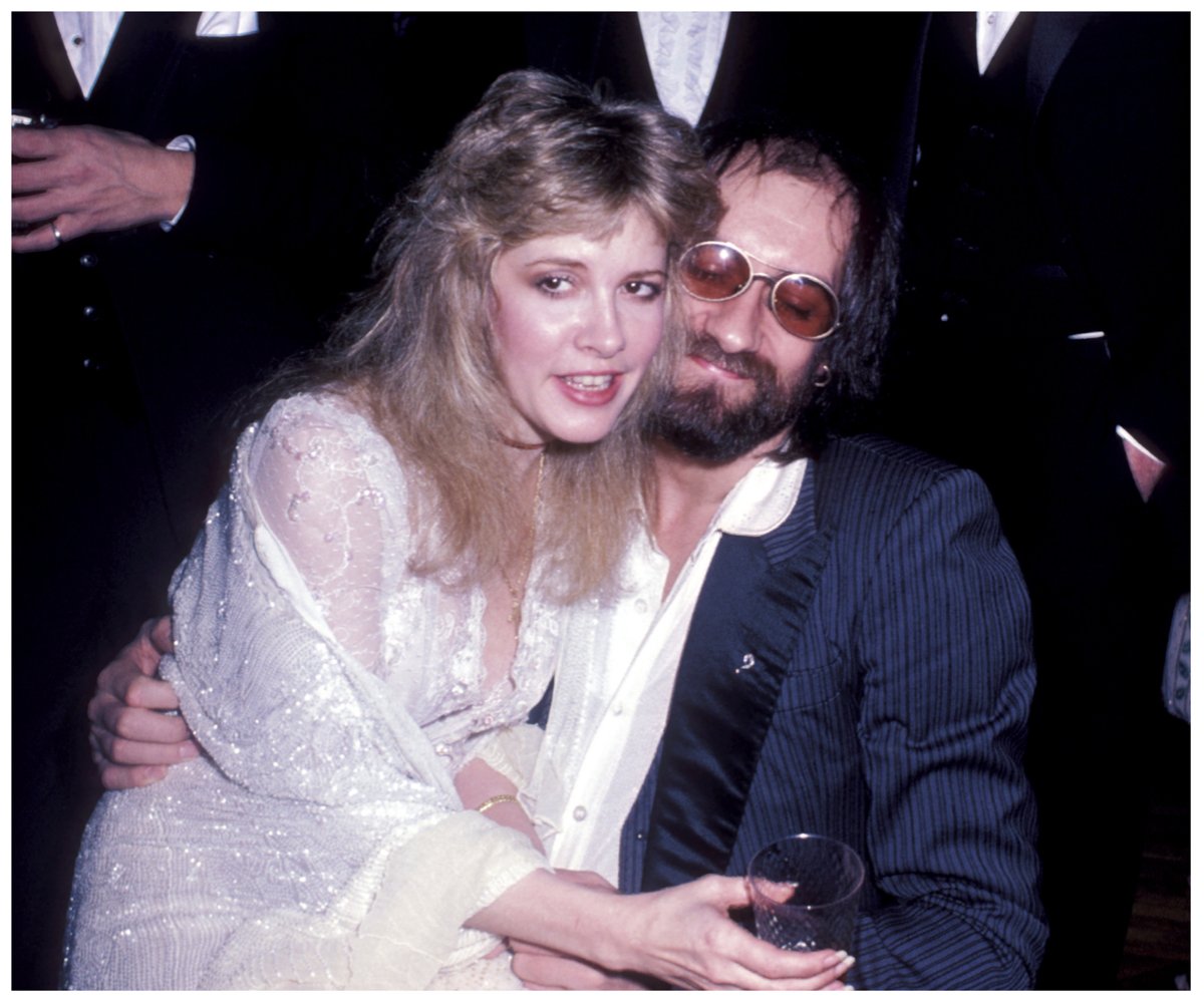 Stevie Nicks and Mick Fleetwood, who once had an affair, pose together with Nicks on Fleetwood's lap.