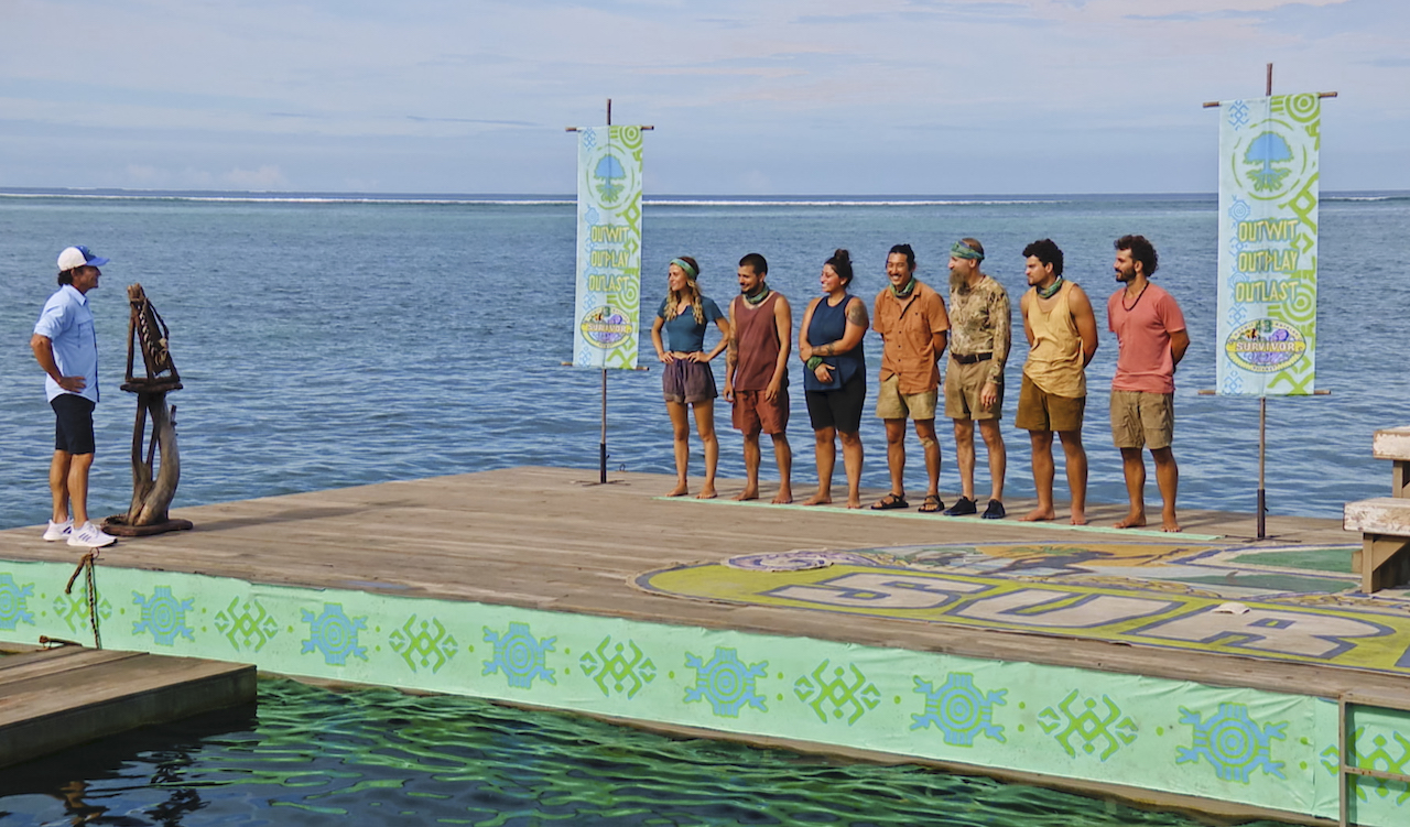 Jeff Probst, Cassidy Clark, Jesse Lopez, Karla Cruz Godoy, Owen Knight, Mike 'Gabler' Gabler, Sami Layadi and Cody Assenmacher stand on platforms that are in the water in an episode of 'Survivor 43'.