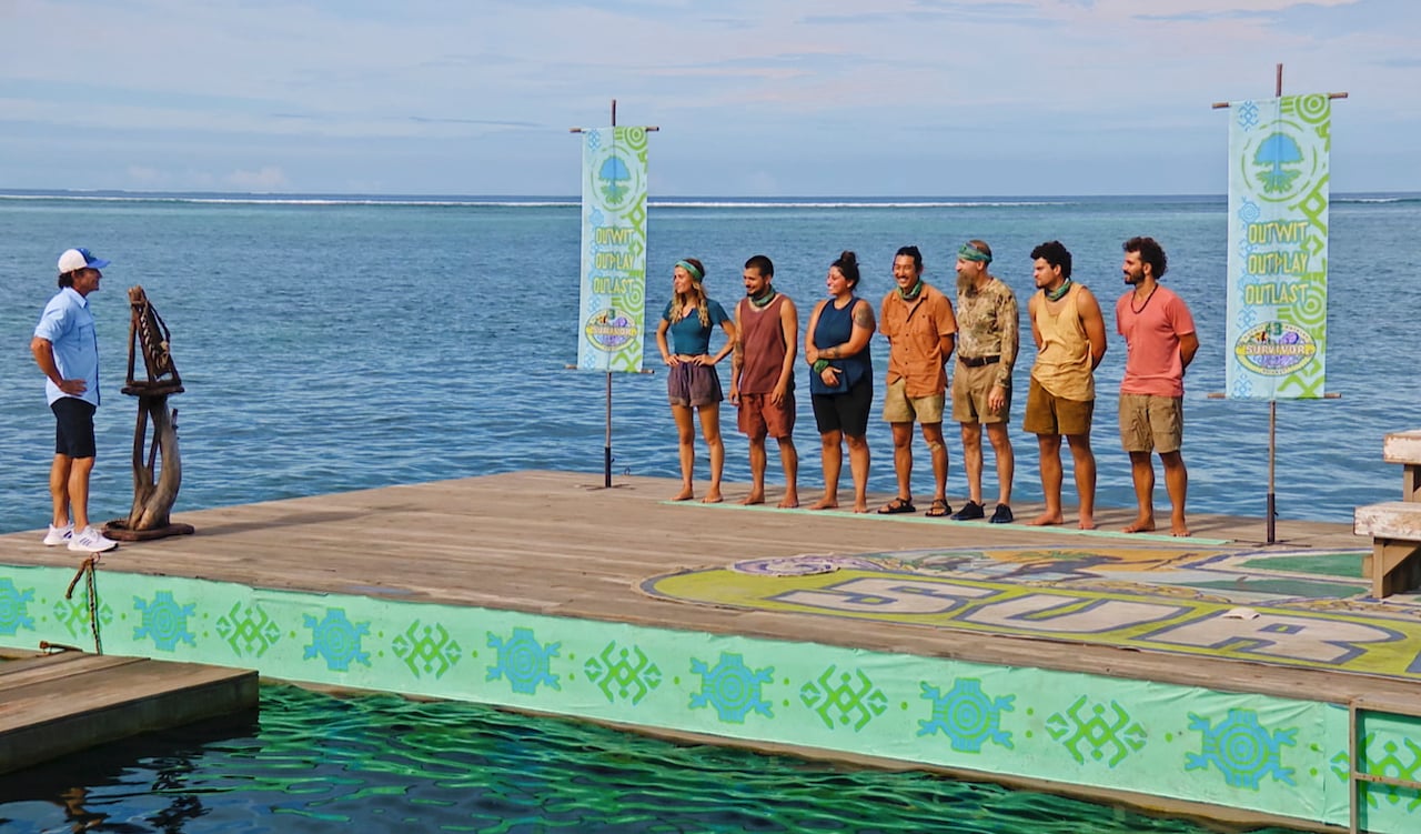 Jeff Probst, Cassidy Clark, Jesse Lopez, Karla Cruz Godoy, Owen Knight, Mike 'Gabler' Gabler, Sami Layadi and Cody Assenmacher stand on platforms that are in the water in an episode of 'Survivor 43'.