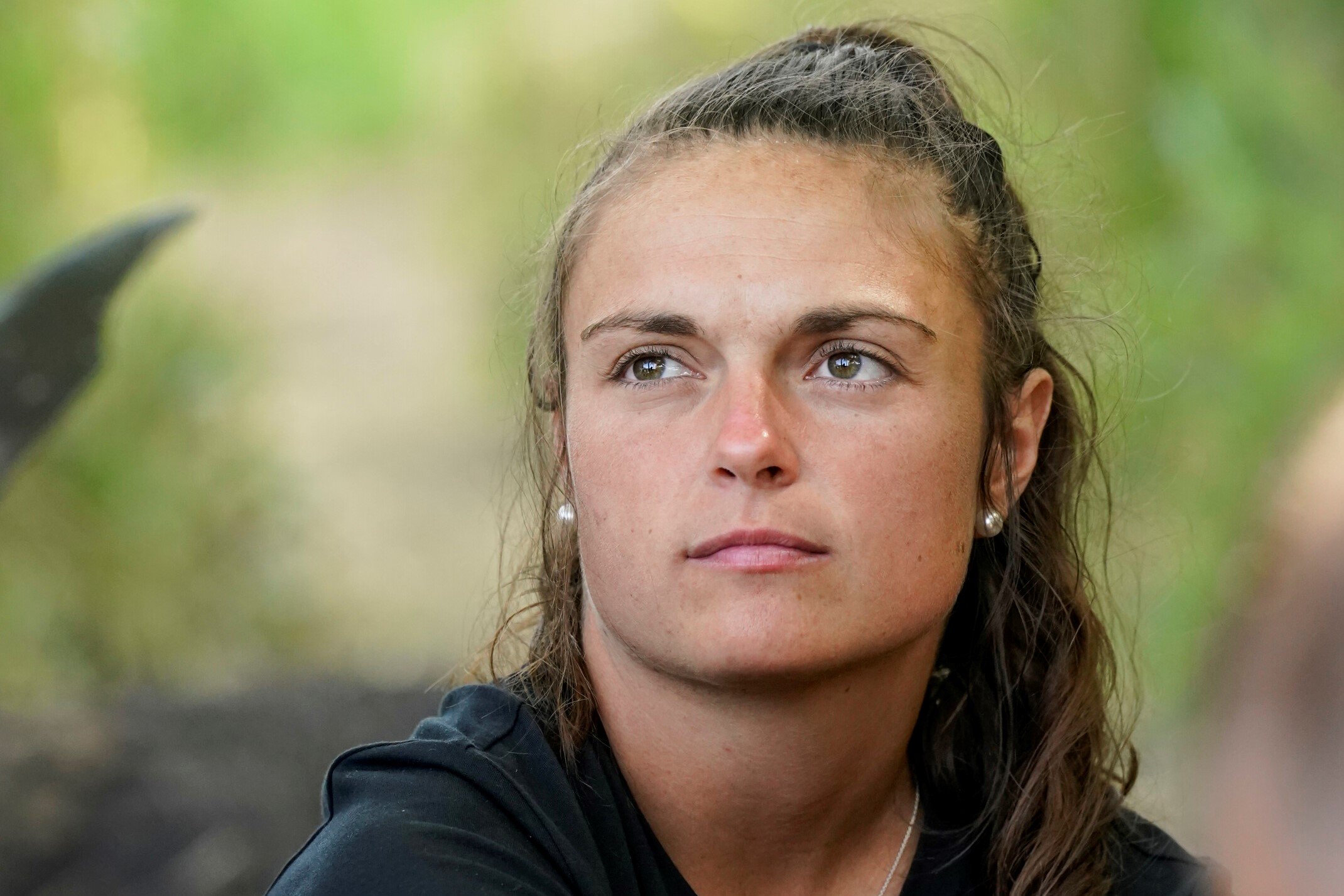 Noelle Lambert, who competes in 'Survivor' Season 43 on CBS, wears a black shirt.