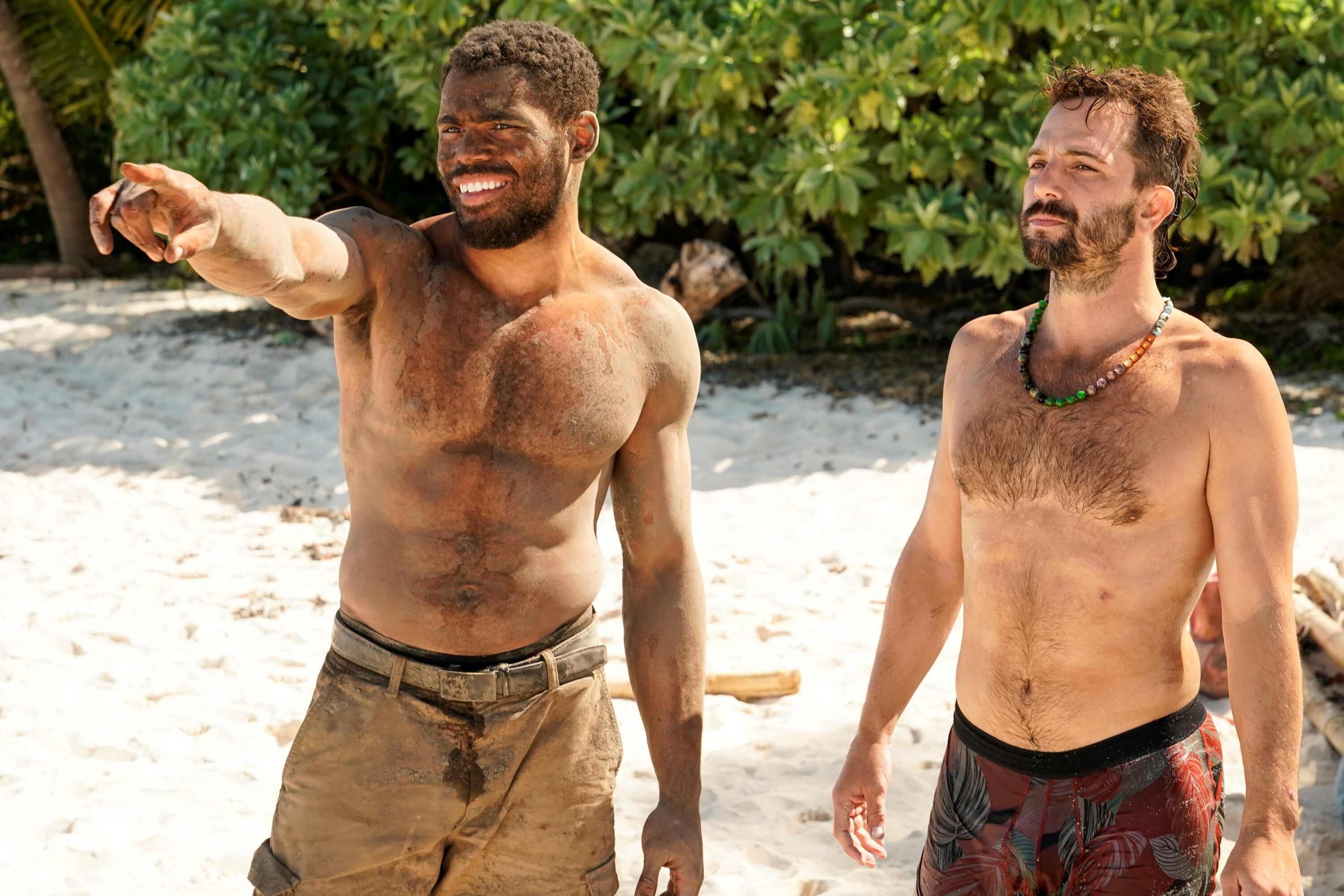 Ryan Medrano and Cody Assenmacher, who star in 'Survivor' Season 43 Episode 7 on CBS, stand on the beach.