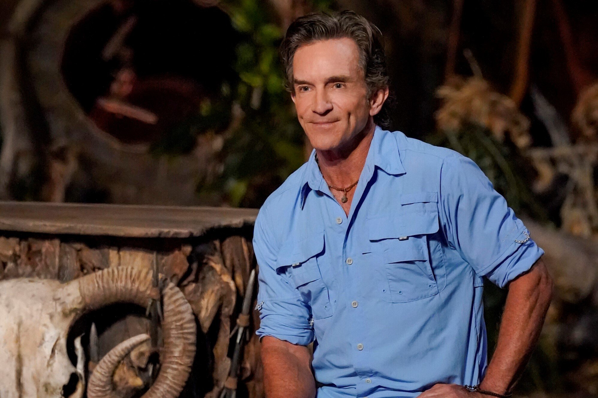 Jeff Probst, the host of 'Survivor' Season 43 on CBS, wears a light blue button-up shirt at Tribal Council.