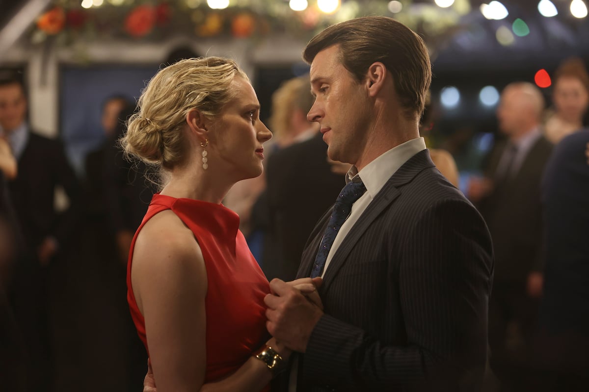 Kara Killmer as Sylvie Brett and Jesse Spencer as Matt Casey dancing together at an event in 'Chicago Fire' Season 10