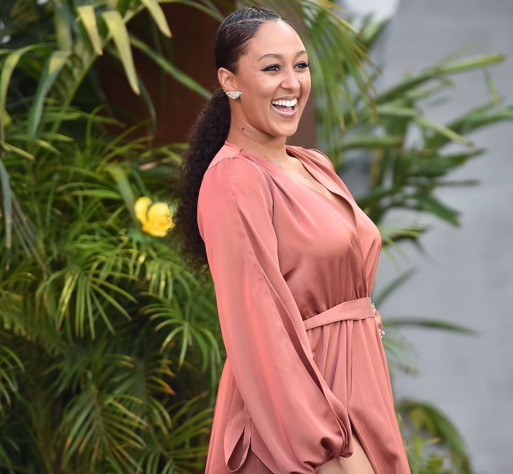 Tamera Mowry smiles; Mowry revealed why she left 'The Real'