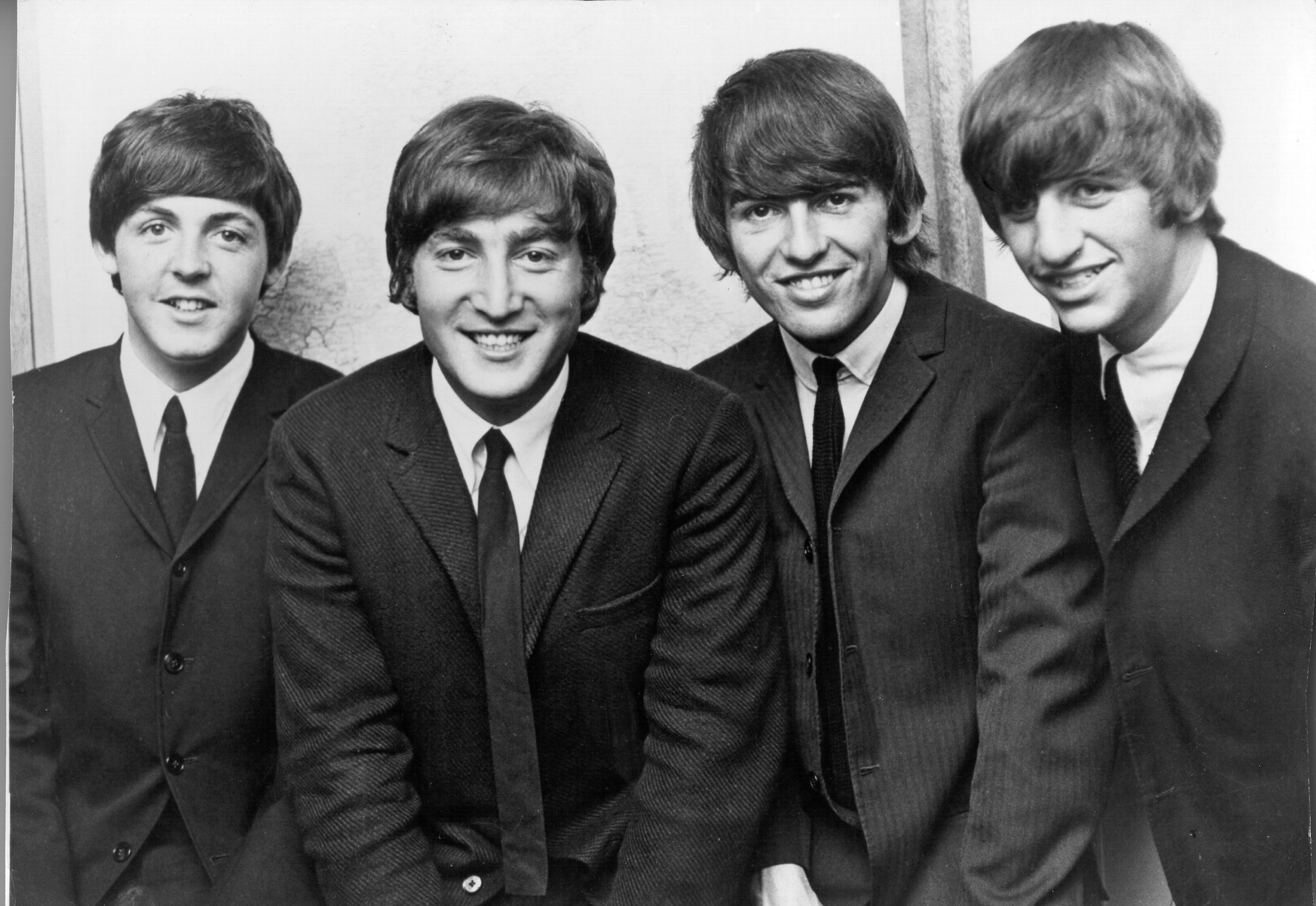 Rock and roll band The Beatles (Paul McCartney, John Lennon, George Harrison, Ringo Starr) pose for a portrait in 1962