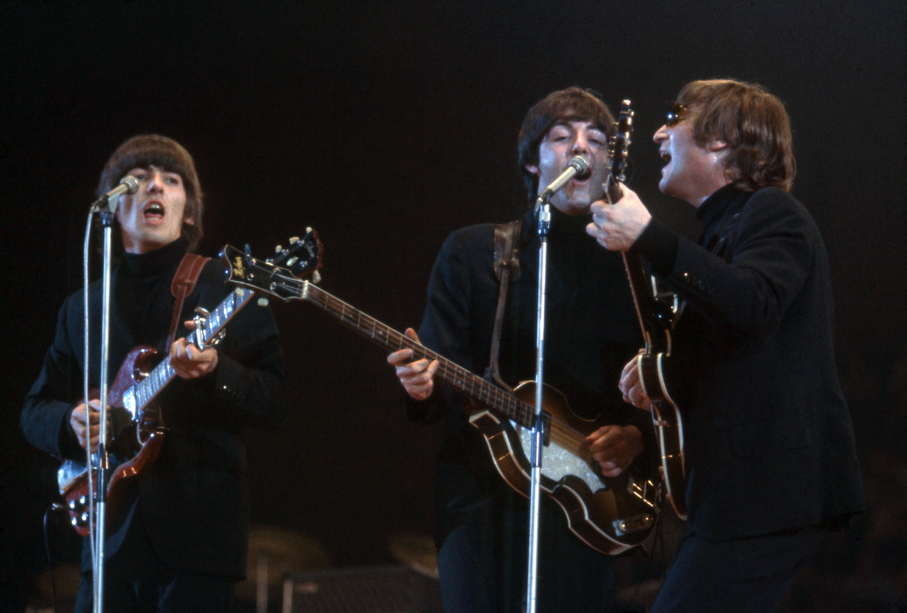 The Beatles performing in black in London, 1966.