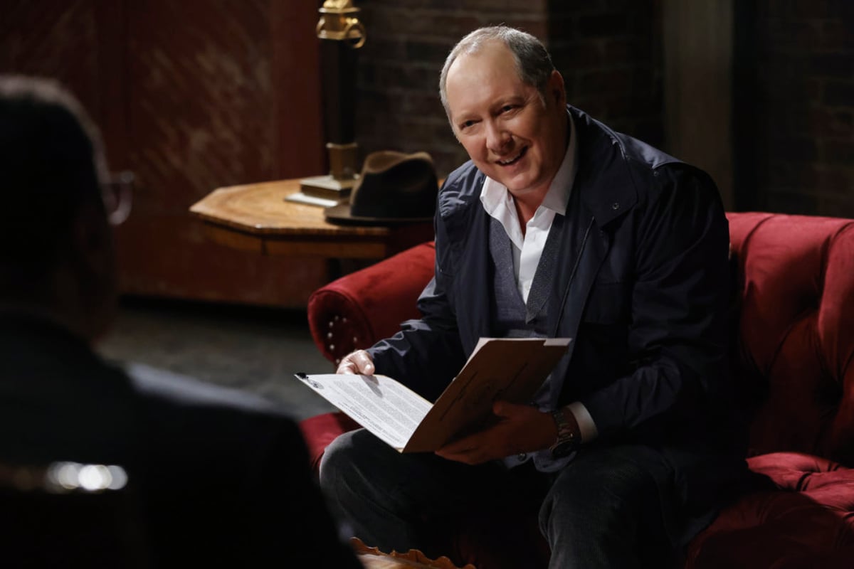 NBC announced The Blacklist Season 10 premiere date. Raymond Reddington sits in a chair holding a folder. 