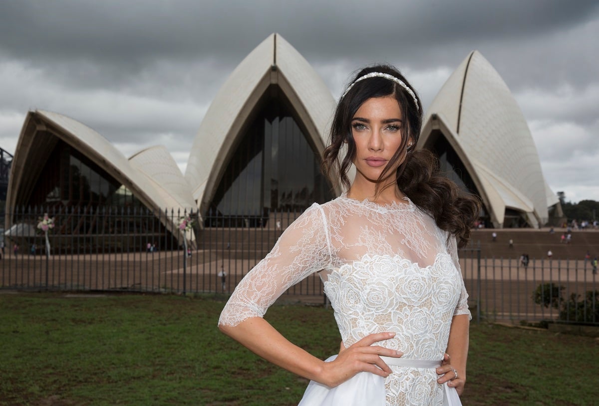 'The Bold and the Beautiful' star Jacqueline MacInnes Wood wearing a wedding dress and posing in front of the Sydney Opera House.