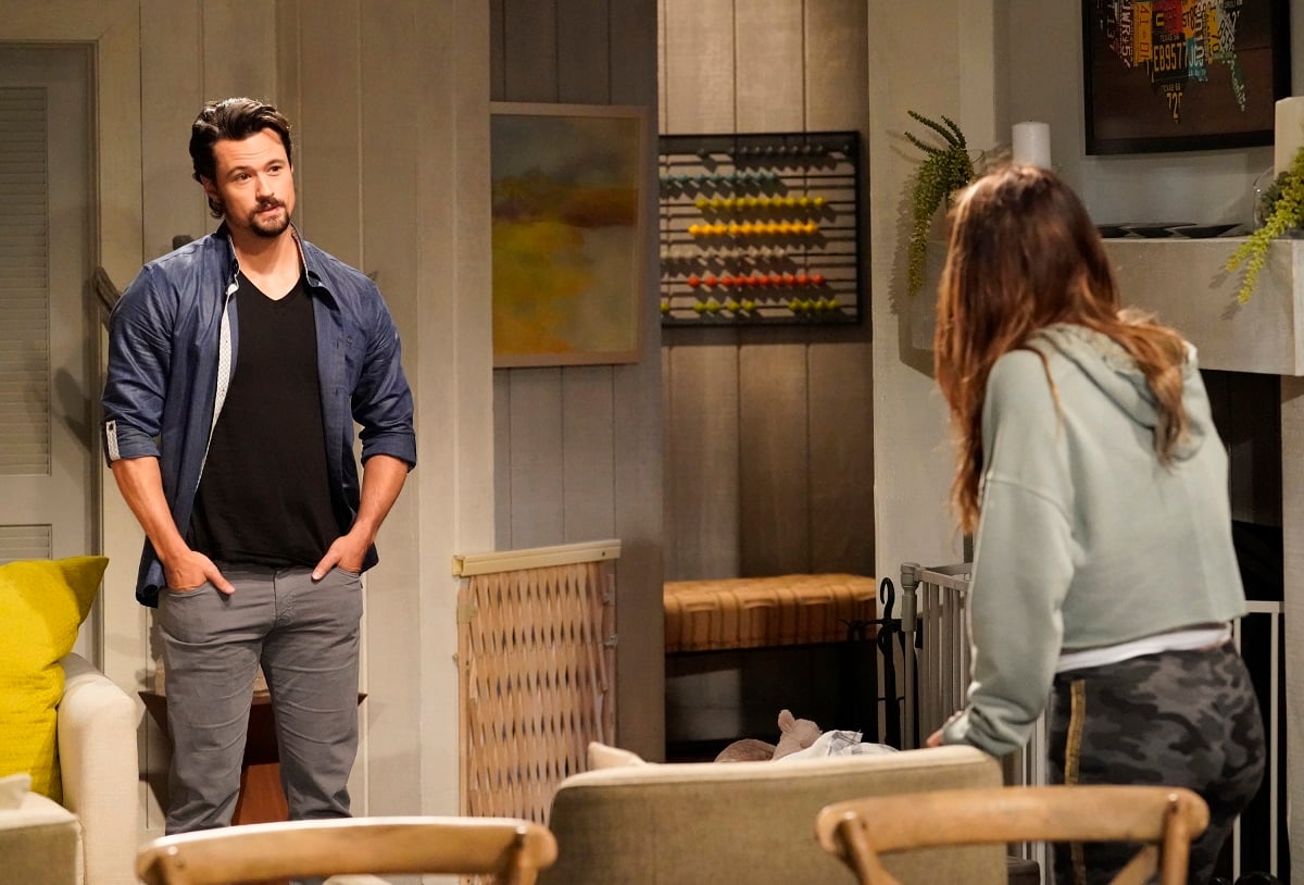 'The Bold and the Beautiful' star Matthew Atkinson dressed in a black shirt and blue jacket; films a scene with co-star Jacqueline MacInnes Wood.