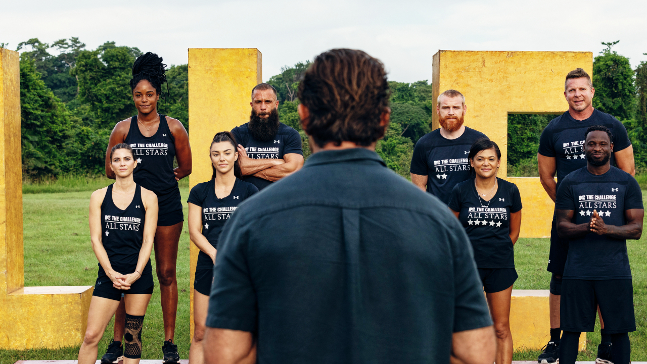 Nia Moore, Brad Fiorenza, Wes Bergmann, Mark Long, KellyAnne Judd, Kailah Casillas, Jonna Mannion, Nehemiah Clark standing in front of host TJ Lavin