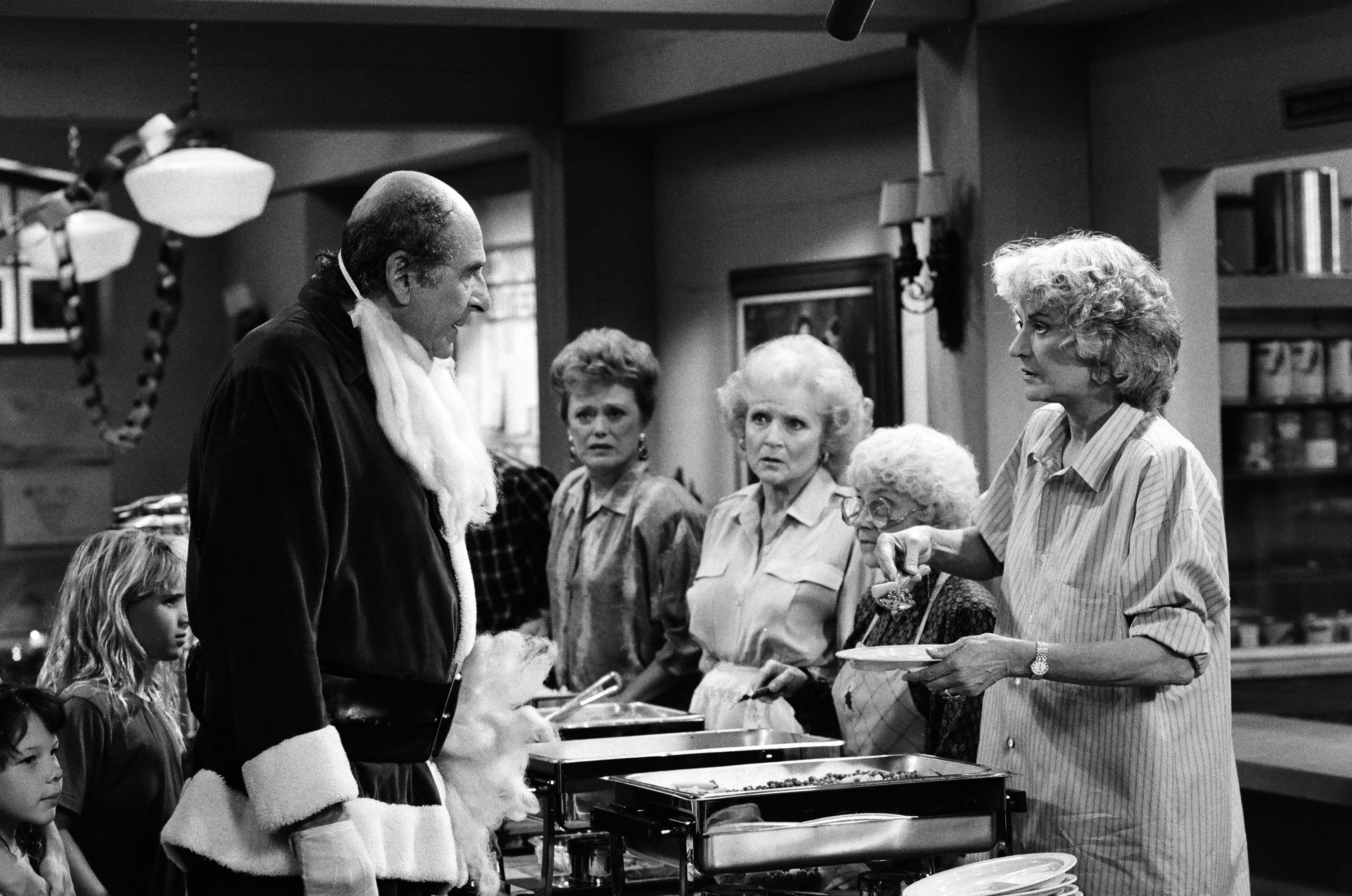 'The Golden Girls' stars Herb Edelman, Rue McClanahan, Betty White, Estelle Getty, and Bea Arthur in a Christmas episode of the series.