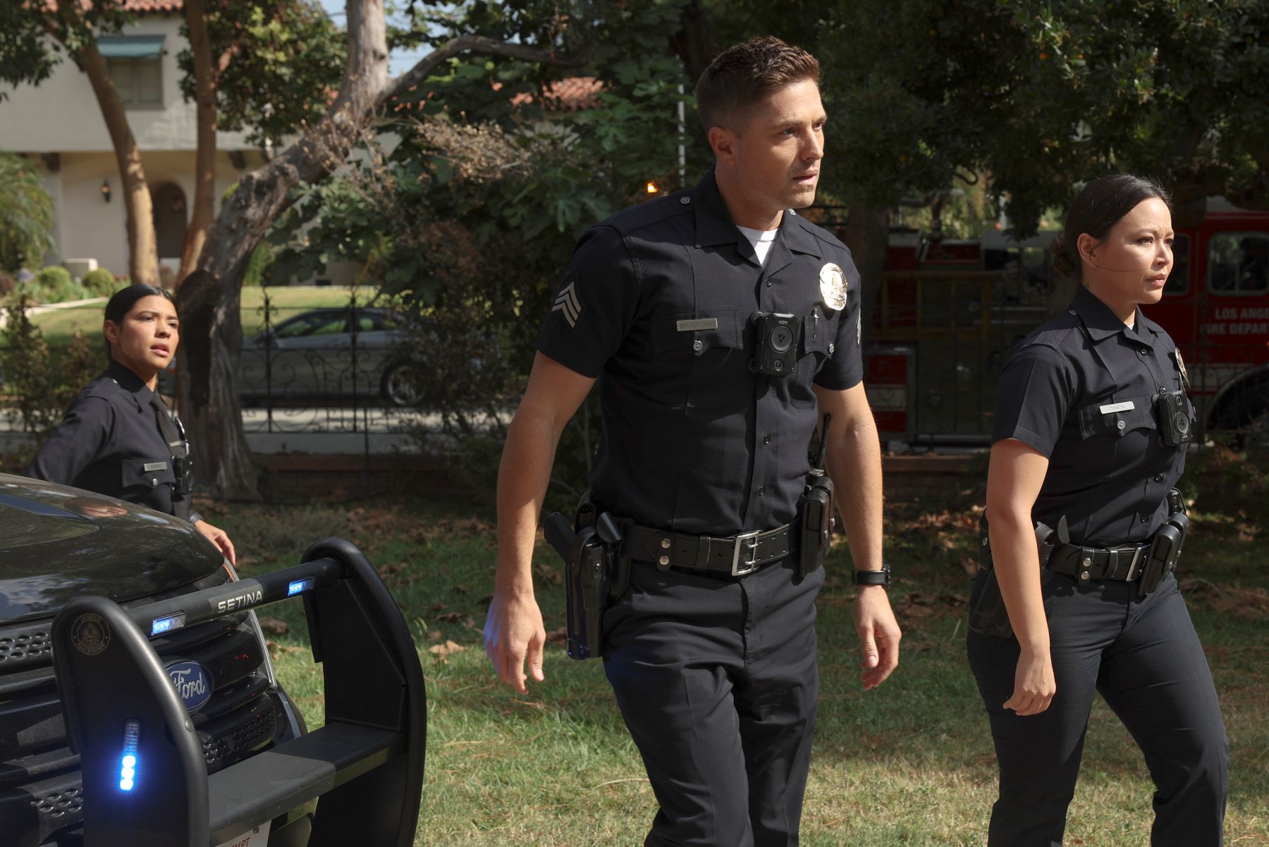 Lisseth Chavez as Celina, Eric Winter as Tim, and Melissa O'Neil as Lucy in 'The Rookie' Season 5 on ABC. They all wear their police uniforms.
