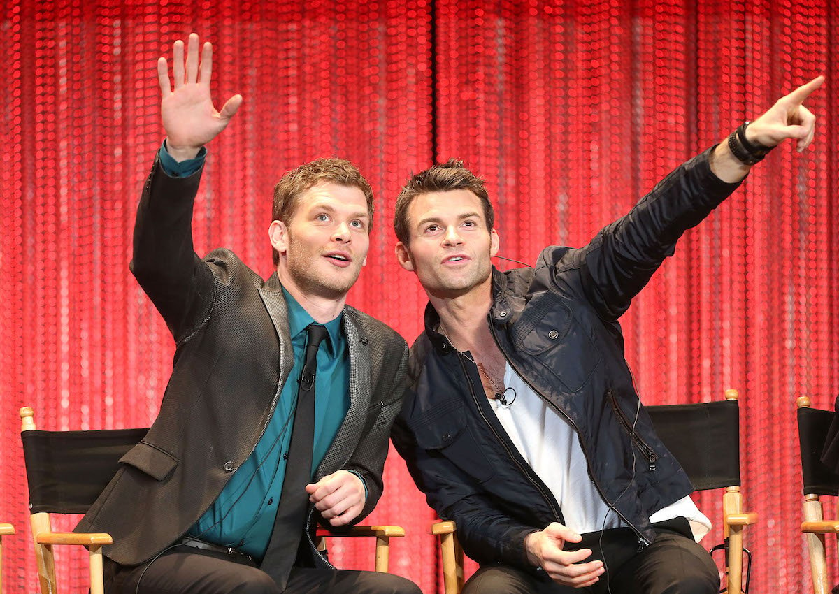 Actors Joseph Morgan (L) and Daniel Gillies wave at fans during The Paley Center for Media's PaleyFest 2014 Honoring "The Vampire Diaries"