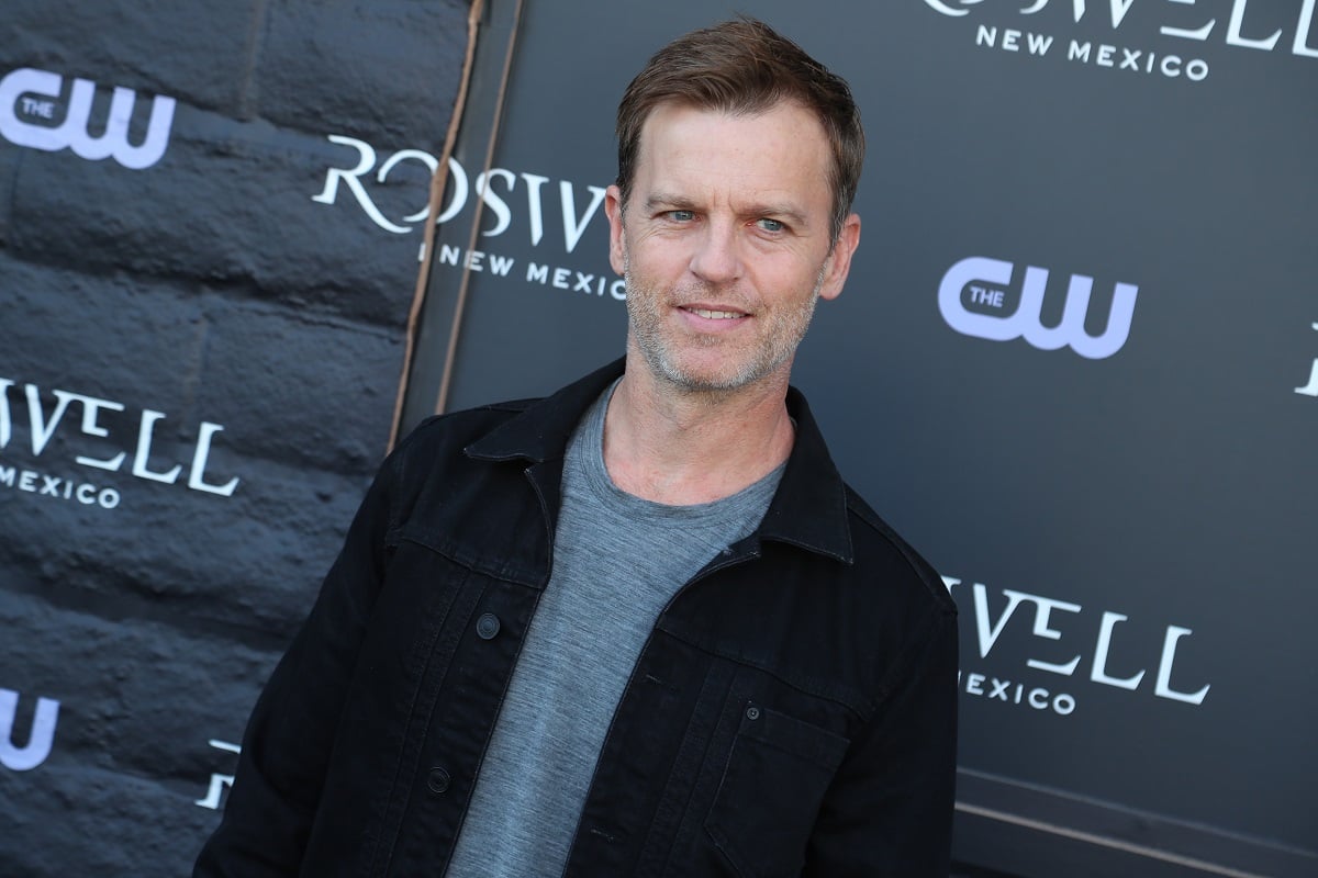 'The Young and the Restless' star Trevor St. John wearing a grey shirt and black shirt during a red carpet appearance.