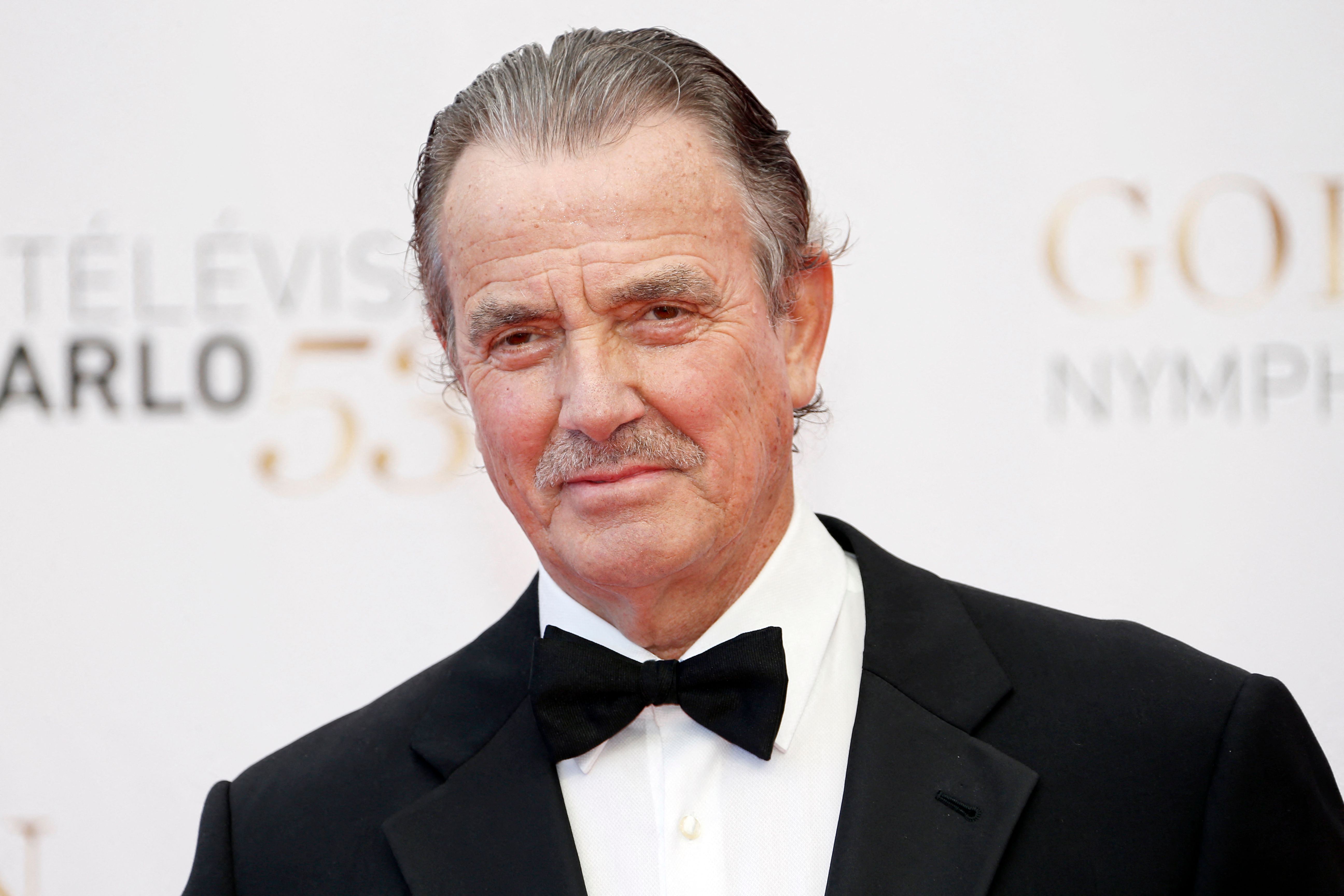 'The Young and the Restless' star Eric Braeden wearing a tuxedo and posing on the red carpet.