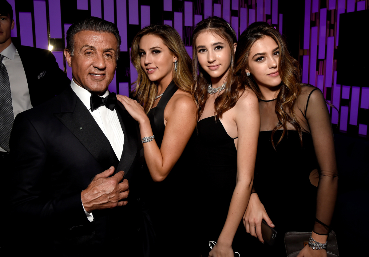 Sylvester Stallone acts alongside his daughter in Tulsa King. Stallone and his daughters pose for a photo at the Golden Globe Awards Post-Party.