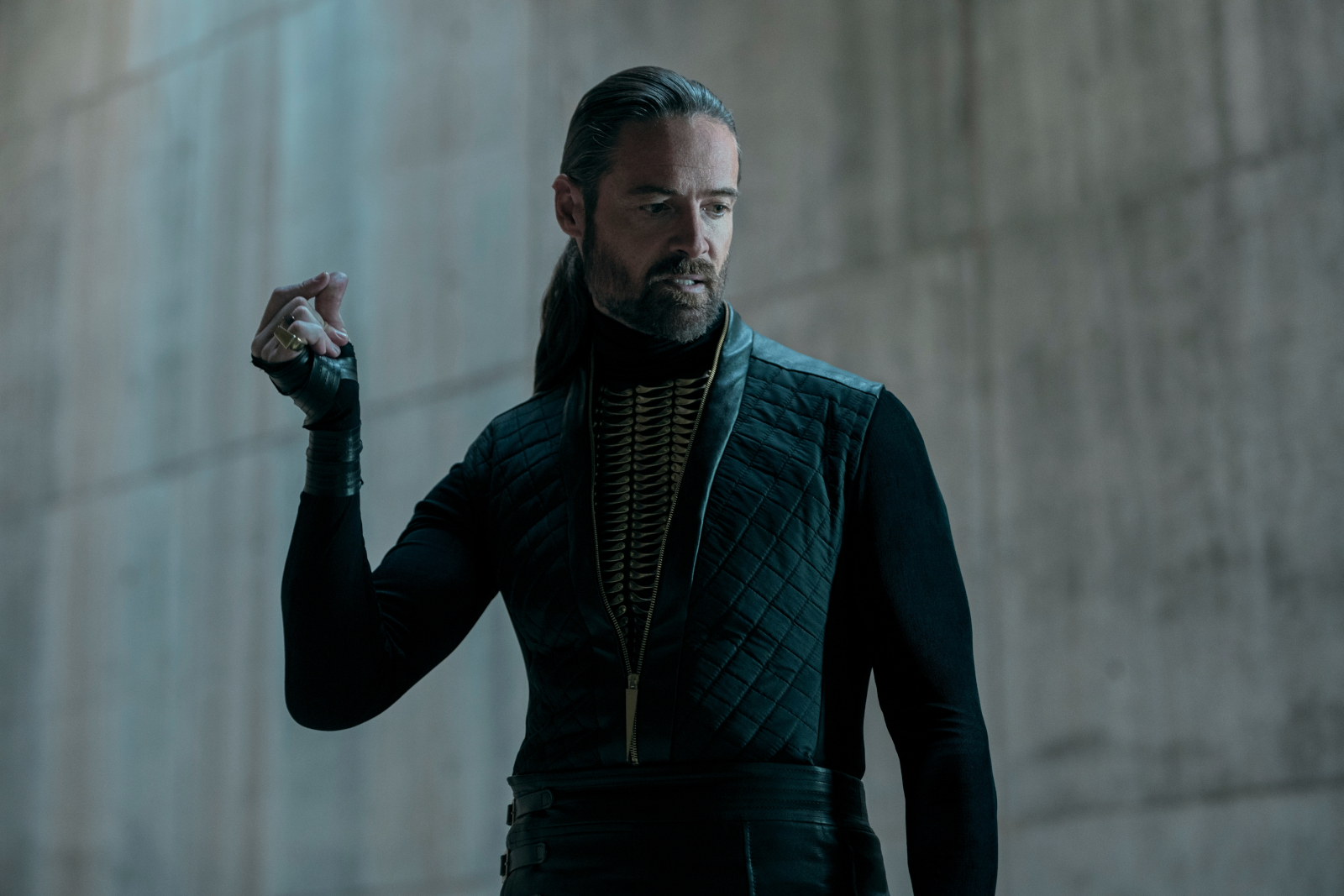 Actor William Miller as Adriel in 'Warrior Nun' Season 2. He's wearing black, has his hair pulled into a ponytail, and looks like he's about to snap his fingers.