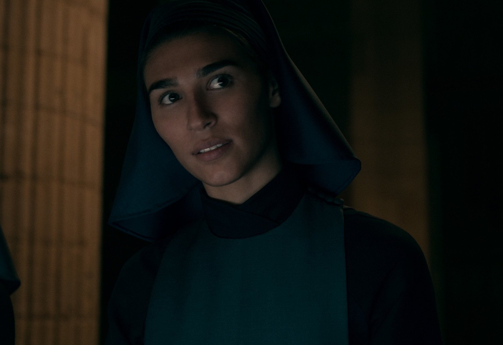 Lorena Andrea as Lilith in 'Warrior Nun' for our recap of season 1. She's wearing a dark dress and habit.