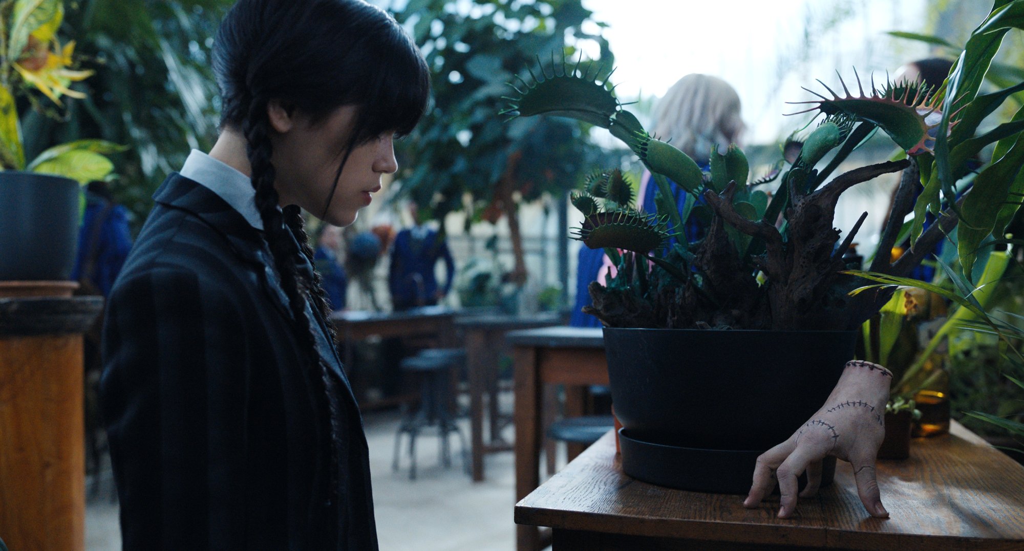 Wednesday talking to Thing in 'Wednesday' series.