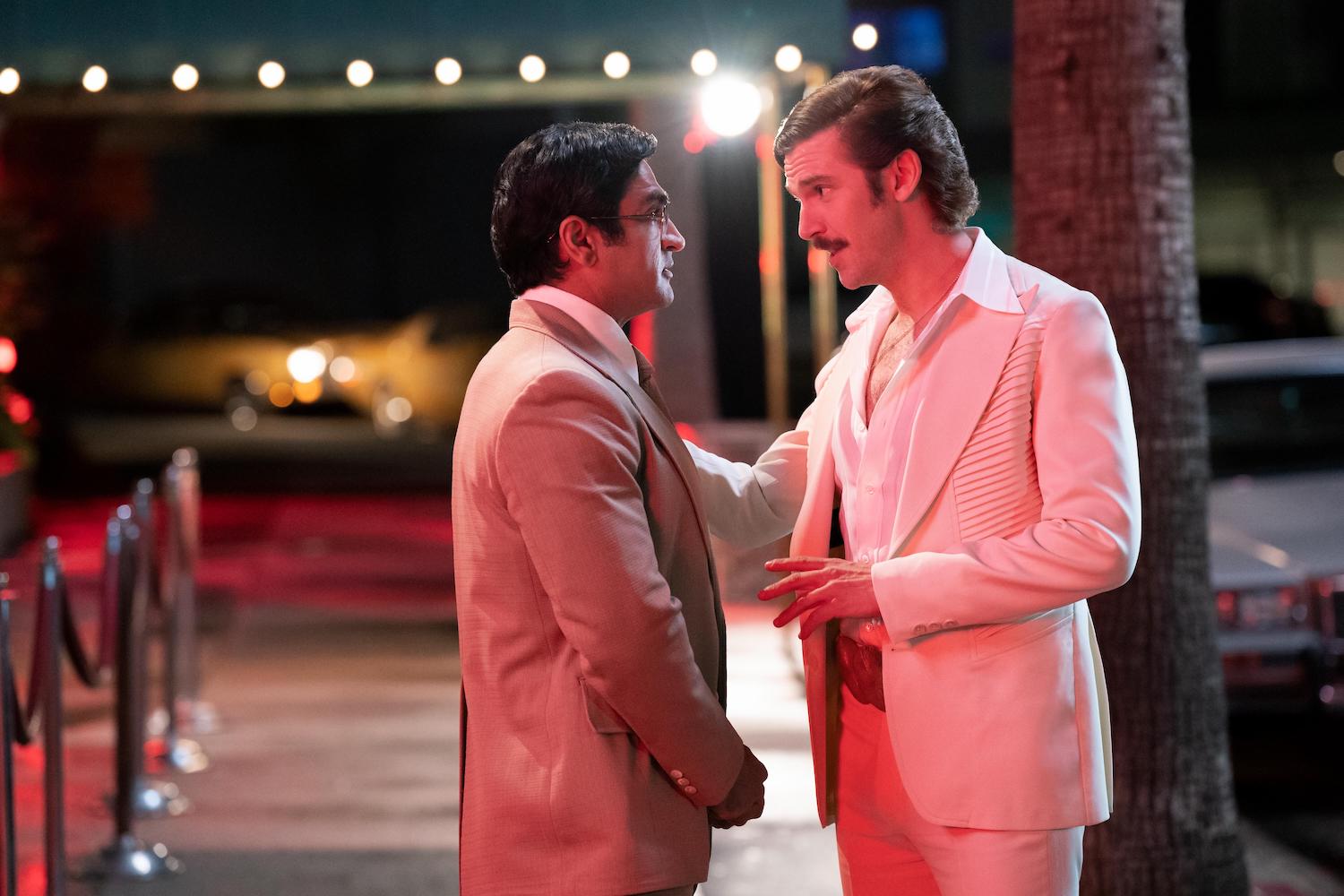 'Welcome to Chippendales' production still showing Kumail Nanjiani and Dan Stevens standing outside a nightclub. The two men play Steve Banerjee and Paul Snider.