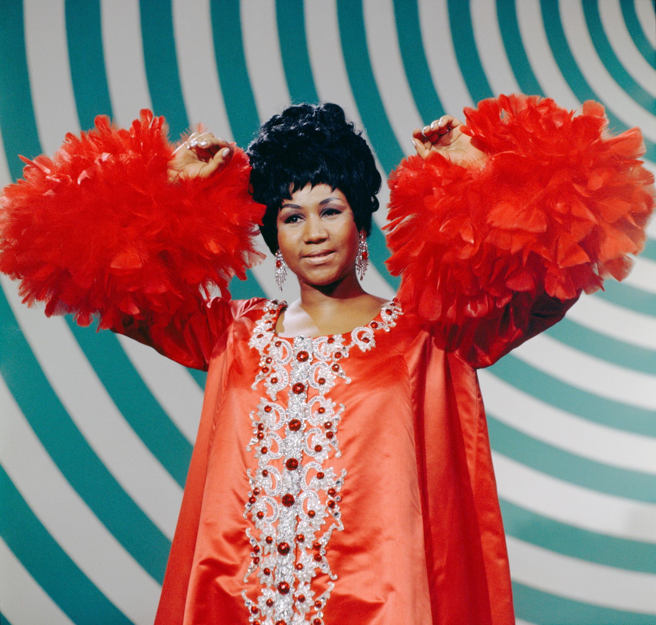 Aretha Franklin wearing red