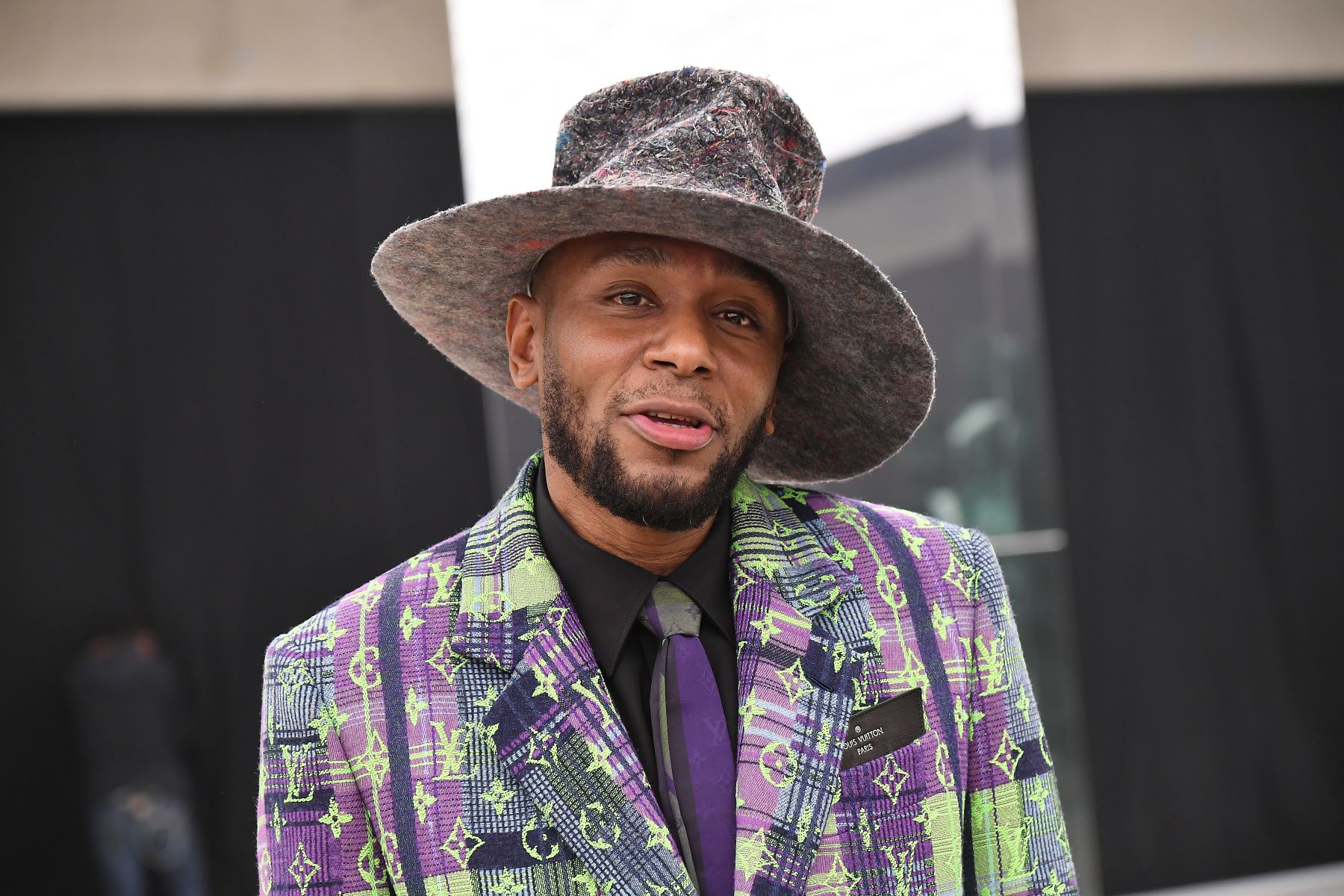 Mos Def (Yasiin Bey) posing during the Louis Vuitton Menswear portion of Paris Fashion Week