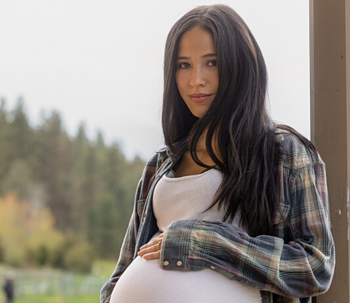 Yellowstone season 5 star Kelsey Asbille poses as a very pregnant Monica Dutton