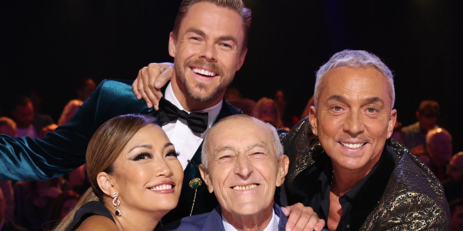 Carrie Ann Inaba, Derek Hough, Len Goodman, and Bruno Tonioli seated behind the judges table of 'Dancing with the Stars.'