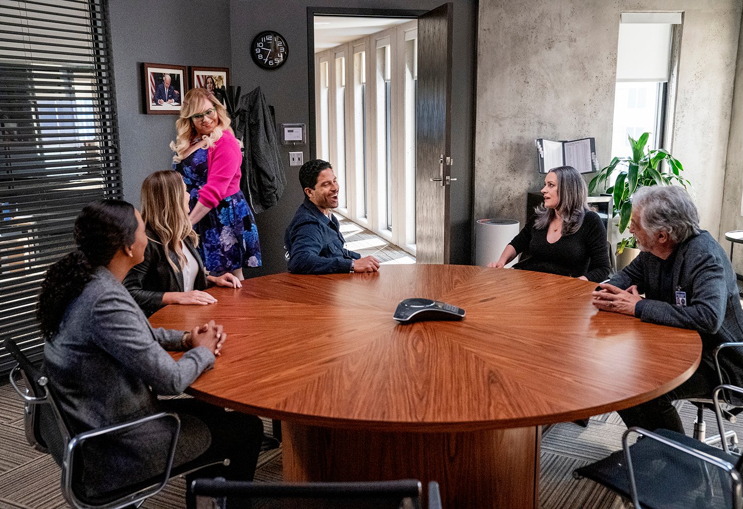 Criminal Minds: Evolution cast and characters: Aisha Tyler as Dr. Tara Lewis, A.J. Cook as Jennifer Jareau, Kirsten Vangsness as Penelope Garcia, Adam Rodriguez as Luke Alvez, Paget Brewster as Emily Prentiss and Joe Mantegna as David Rossi sitting around a table in the BAU office.