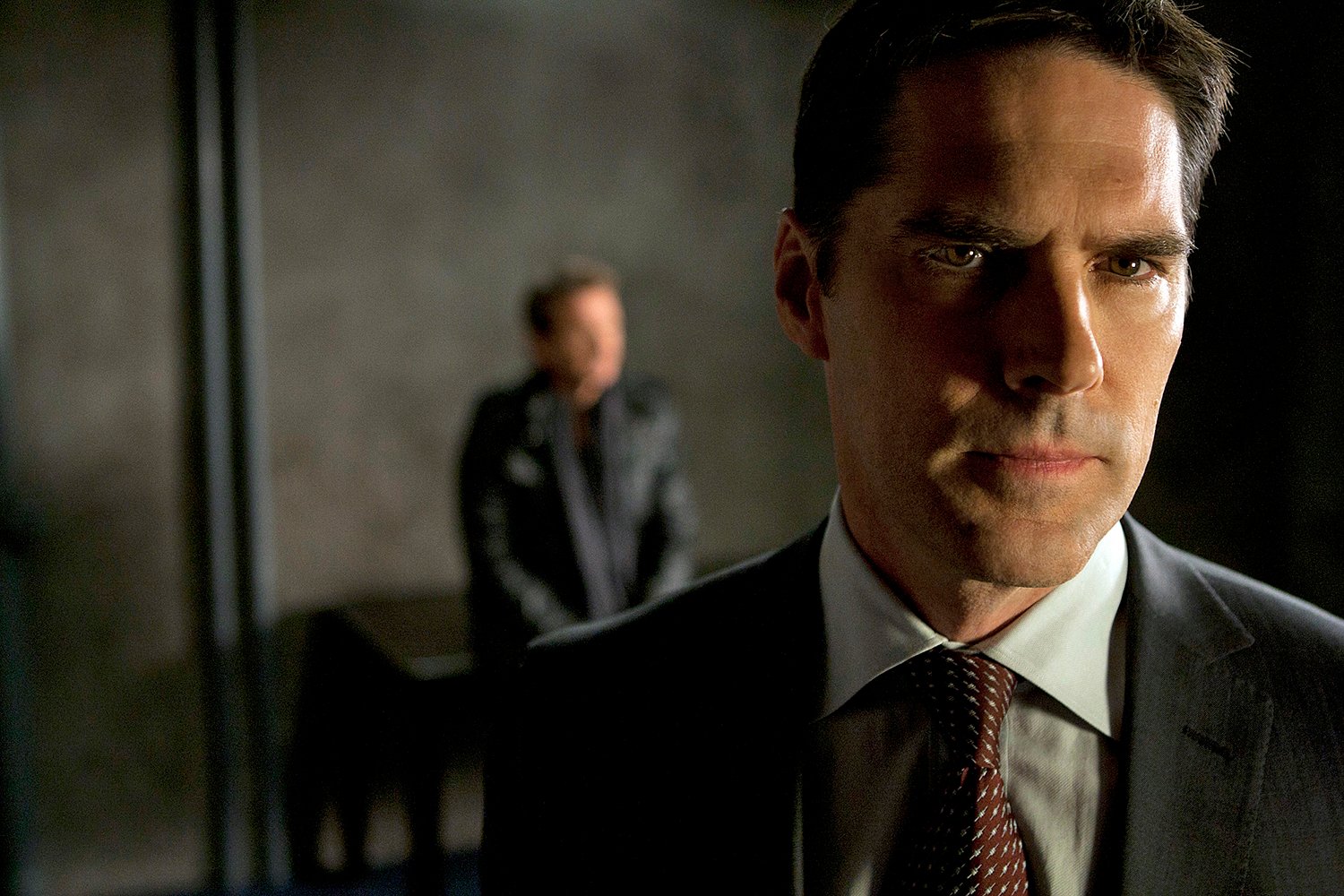 Saddest episodes of Criminal Minds: Thomas Gibson's Aaron Hotchner looks off-camera in a black suit in 'Lauren.'